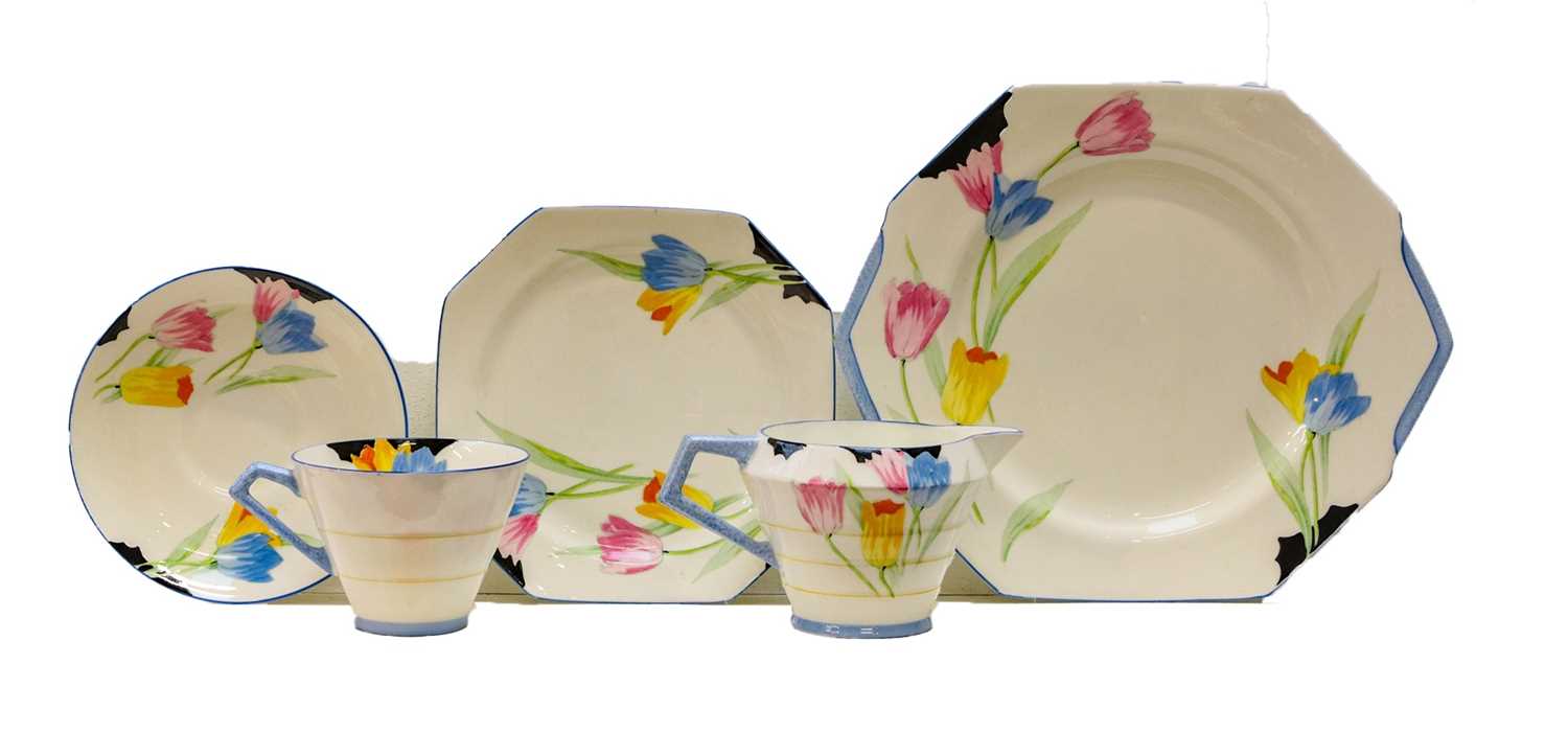 A Paragon 'Tulip' pattern heart tea set, comprising sandwich plate, twelve side plates, nine cups