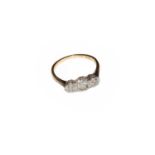 A diamond three stone ring, stamped '18CT' and 'PLAT', finger size M1/2Condition report: The ring is