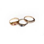A 9 carat gold diamond half hoop ring, finger size M; a sapphire and diamond three stone ring,