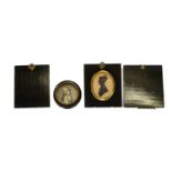 A portrait miniature of a young girl, two miniature frames, and a circular framed portrait print (