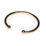 A 9 carat gold torque bangle, inner measurements 6.8cm by 5.2cm approximatelyCondition report: The