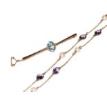 A 9 carat gold amethyst and cultured pearl necklace, length 65cm; and a blue topaz bar brooch,