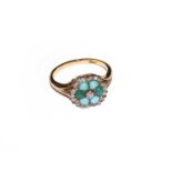 A turquoise and diamond cluster ring, stamped '18CT', finger size OCondition report: The ring is