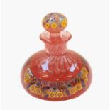 A millefiori glass ink bottle and stopper, the knop and base set with concentric canes, 11cm high,