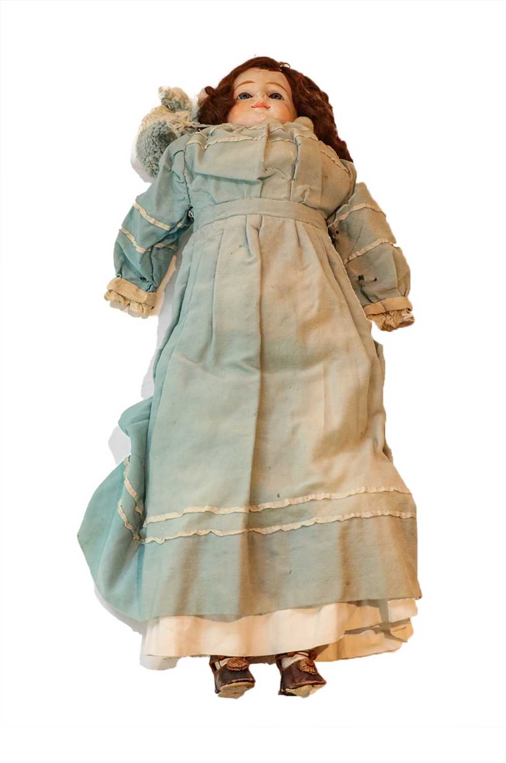 Circa 1900 composition shoulder doll, with fixed glass eyes, painted eyelashes, original brown