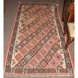 A Kilim, probably South-West Iran, dated 1949, the stepped diamond lattice field of geometric motifs