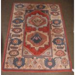 An Afshar Kilim, the polychrome field with wide and narrow bands of geometric motifs, enclosed by
