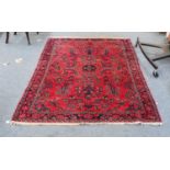 A Lilihan rug, the strawberry field of floral vines enclosed by midnight blue borders of