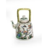 A Chinese Porcelain Kettle and Cover, Kangxi, of bell shape with overhead handle, painted in famille