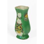 A Chinese Sancai Glazed Porcelain Vase, Kangxi, of square section baluster form, moulded with lion