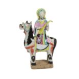 A Chinese Porcelain Figure Group, 19th century, as a female immortal sitting on a horse playing a