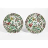 A Pair of Chinese Porcelain Plates, Kangxi, of fluted circular form, painted in famille verte
