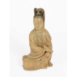 A Chinese Soapstone Figure of Guanyin, Qing Dynasty, 18th century, carved seated with hair up,