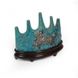 A Chinese Turquoise Glazed Brush Rest, Kangxi, of crescent form with five points above a kylin and