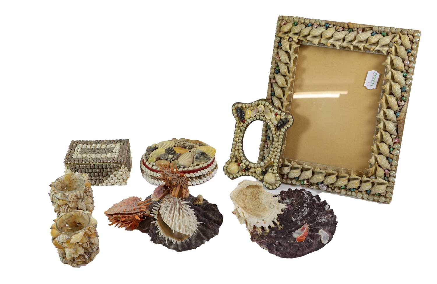 A Shell Photograph Frame, circa 1900, of shaped rectangular form, applied with various shells,