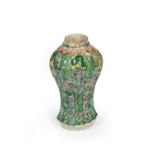 A Chinese Porcelain Vase, Kangxi, of fluted oval section baluster form, painted in famille verte