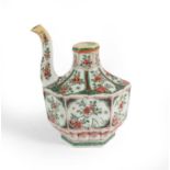 A Chinese Porcelain Ewer, Kangxi, of fluted hexagonal form with scroll spout, painted in famille
