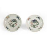 A Pair of Chinese Porcelain Small Dishes, Kangxi, of fluted circular form, painted in famille