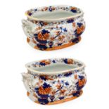 A Pair of Staffordshire Ironstone China Footbaths, circa 1830, of cushioned oval form with scroll