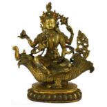 A Sino-Tibetan Gilt Bronze Figure of Bodhisattva, in 17th century style, seated on the back of a