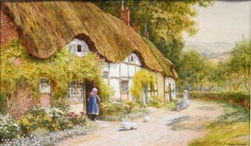 Arthur Claude Strachan (1865-1938)Country girl at the door of a thatched cottageSigned,