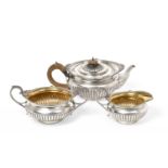 A Three-Piece Victorian Silver Tea-Service by Walter and John Barnard, London, 1891