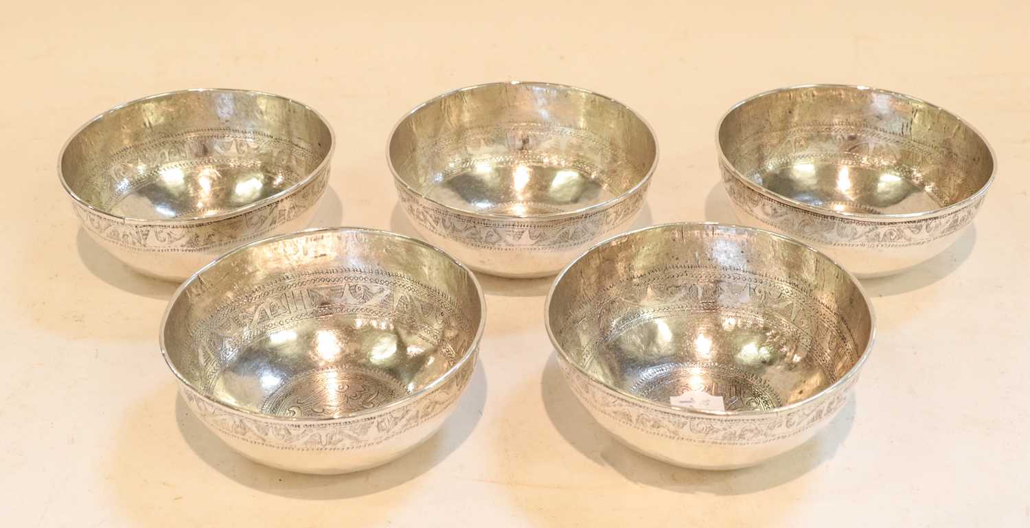 A set of five silver bowls, possibly Libyan, apparently dated 1945 in Arabic, each tapering