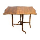 A Victorian Rosewood Sutherland Table, circa 1860, with twin drop leaves to form a moulded