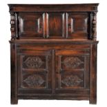 A Salisbury Joined Oak Press Cupboard, late 17th century, the later boarded top above a moulded