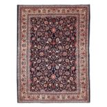 Saroukh CarpetWest Iran, Circa 1940The indigo field with an allover design of palmettes and