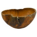 A Scandinavian Dug-Out Burr Wood Bowl, dated 1784, of asymmetrical oval form, the base incised LPS