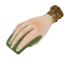 A Victorian Gilt Metal Mounted Porcelain Scent Bottle, in the form of a hand holding a book, the
