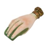 A Victorian Gilt Metal Mounted Porcelain Scent Bottle, in the form of a hand holding a book, the