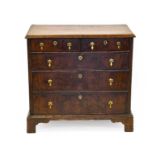 A George I Walnut, Feather-Banded and Crossbanded Straight Front Chest of Drawers, early 18th