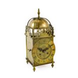 A Lantern Form Striking Mantel Clock, circa 1910, four posted frame case, pierced top frets, side