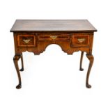 ^ A George II Walnut and Feather-Banded Dressing Table, 2nd quarter 18th century, with three