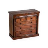 A Victorian Mahogany and Pine-Lined Miniature Chest, 3rd quarter 19th century, the moulded frieze