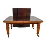 A Victorian Mahogany Extending Dining Table, circa 1870, with three original additional leaves,