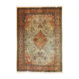 Tabriz CarpetNorth West Iran, circa 1960The pistachio-green field of flowering vines centred by a