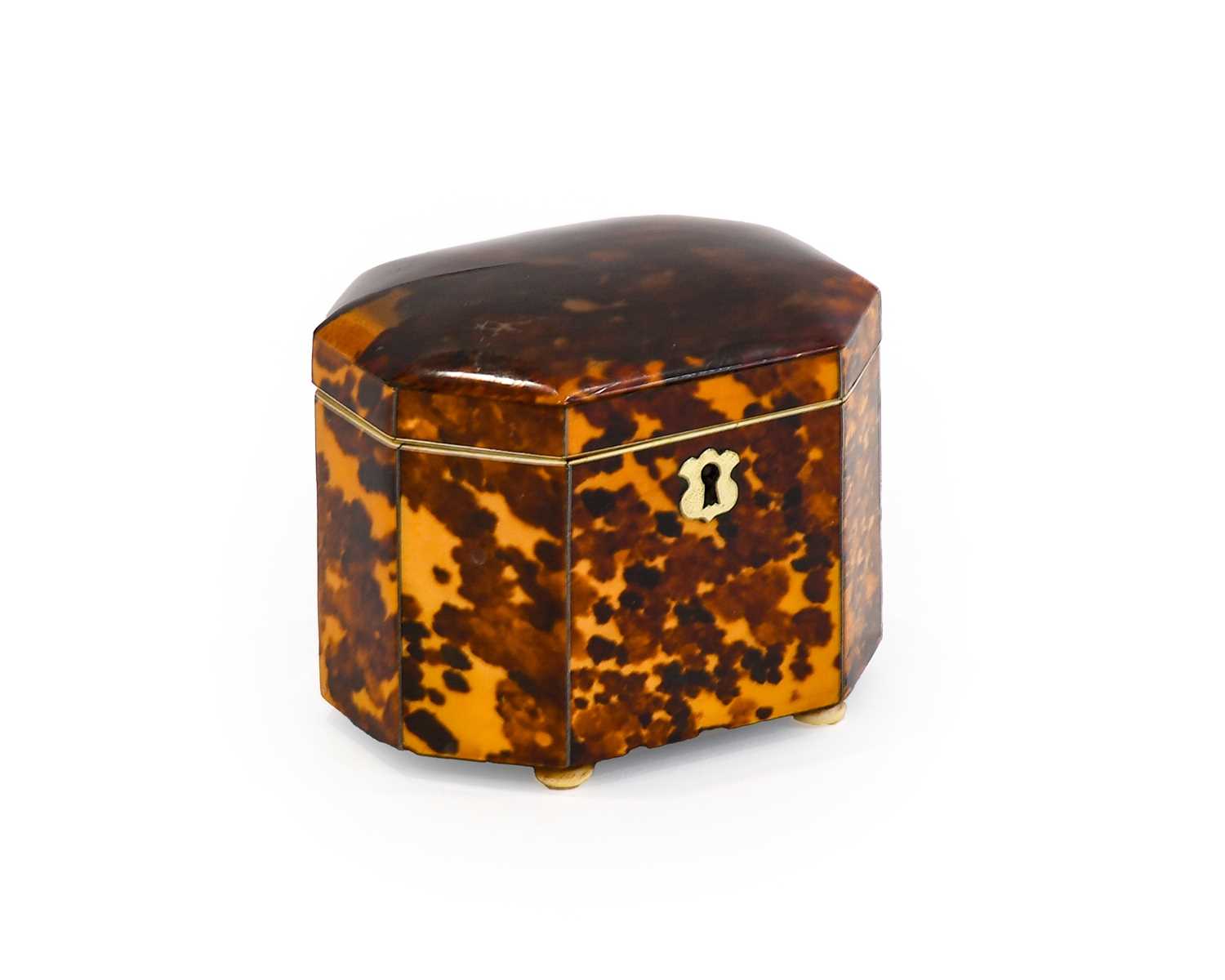 A Regency Ivory Mounted Tortoiseshell Tea Caddy, of domed canted rectangular form, the hinged