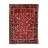 Sultanabad CarpetWest Iran, circa 1930The soft tomato diamond lattice field of angular vines and