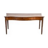 ^ A George III Mahogany Serpentine Shaped Table, circa 1780, the moulded top above a plain frieze,