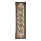 North-West Persian Runner circa 1960The ivory field with a column of medallions and serrated