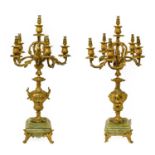 A Pair of Gilt Metal and Onyx Six-Light Candelabra, late 19th century, with urn shape scones and