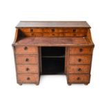 An Early 19th Century Brown Oak Writing Desk, the superstructure with tracery stringing above six