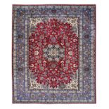 Isfahan CarpetCentral Iran, Circa 1920The raspberry field of flowing vines around an indigo