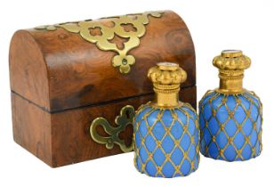 A Pair of French Gilt Metal Mounted Blue Glass Scent Bottles, circa 1860, of shouldered
