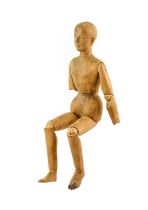 An Artist's Lay Figure, 19th century, naturalistically carved with articulated head and limbs,