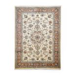 Mashad CarpetNorth East Iran, circa 1980 The ivory field of palmettes and vines around a