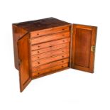 A Mid 19th Century Mahogany Collector’s Cabinet, the cupboard doors with gadrooned moulding